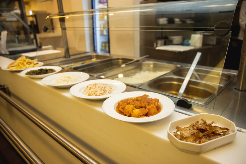 Picture of a lineup of dishes at a campus cafeteria.